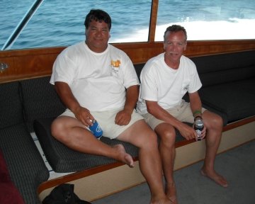 men relaxing on boat