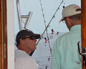 Captain Joe Drosey with friend from inside the boat